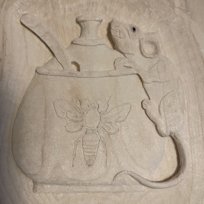 1st test piece featuring a hand carved Mouse on a Jar of honey